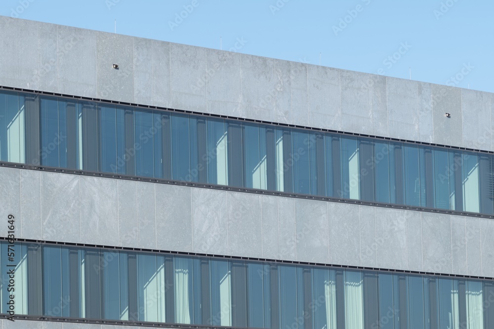 Fototapeta premium white and grey warehouse building with windows