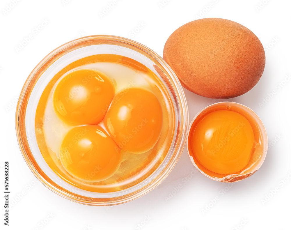 Brown chicken egg and egg yolks in glass bowl on white background. Clipping path.