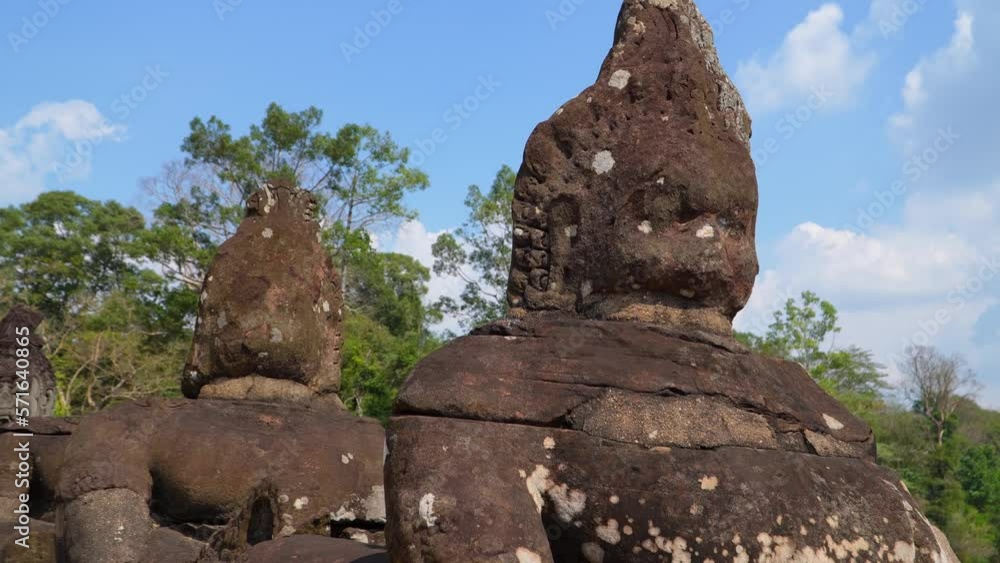 Ancient ruins Thom Bayon temple - famous Cambodian landmark, Angkor Wat complex of temples. Siem Reap, Cambodia. Ancient ruins Thom Bayon temple - famous Cambodian landmark, Angkor Wat complex of temples. Siem Reap, Cambodia.