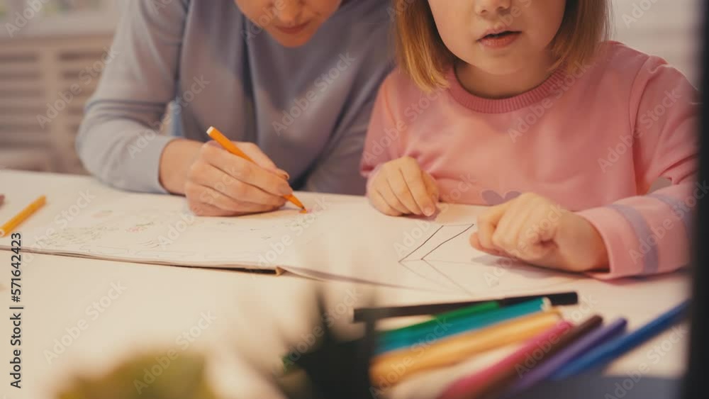 Little girl and her mother drawing and having fun at home, talent development Little girl and her mother drawing and having fun at home, talent development