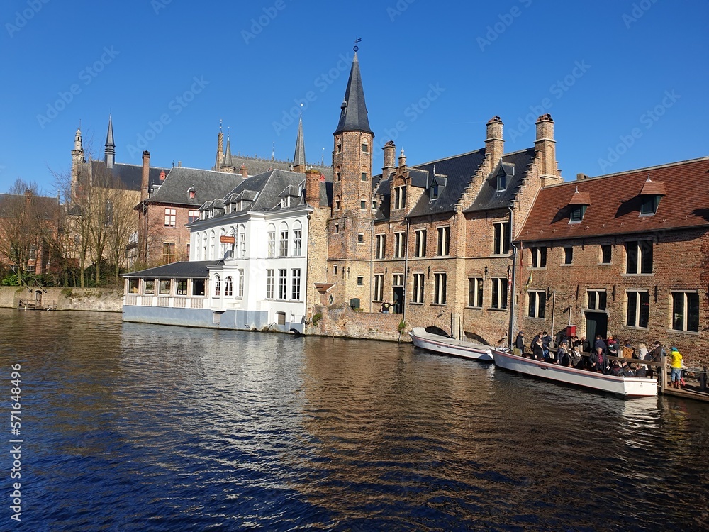 Classic panoramic view of the historic city center of Bruges (Brugge), West Flanders province, Belgium. Cityscape of Bruges with canal. Brugge streets and historic centre of medieval historic city.