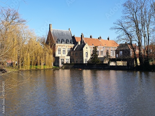 Classic panoramic view of the historic city center of Bruges (Brugge), West Flanders province, Belgium. Cityscape of Bruges with canal. Brugge streets and historic centre of medieval historic city.