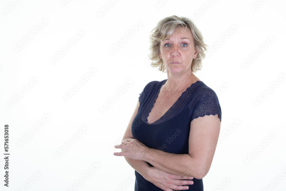 blond surprised expression mature woman folded arms crossed middle aged on white background blond surprised expression mature woman folded arms crossed middle aged on white background