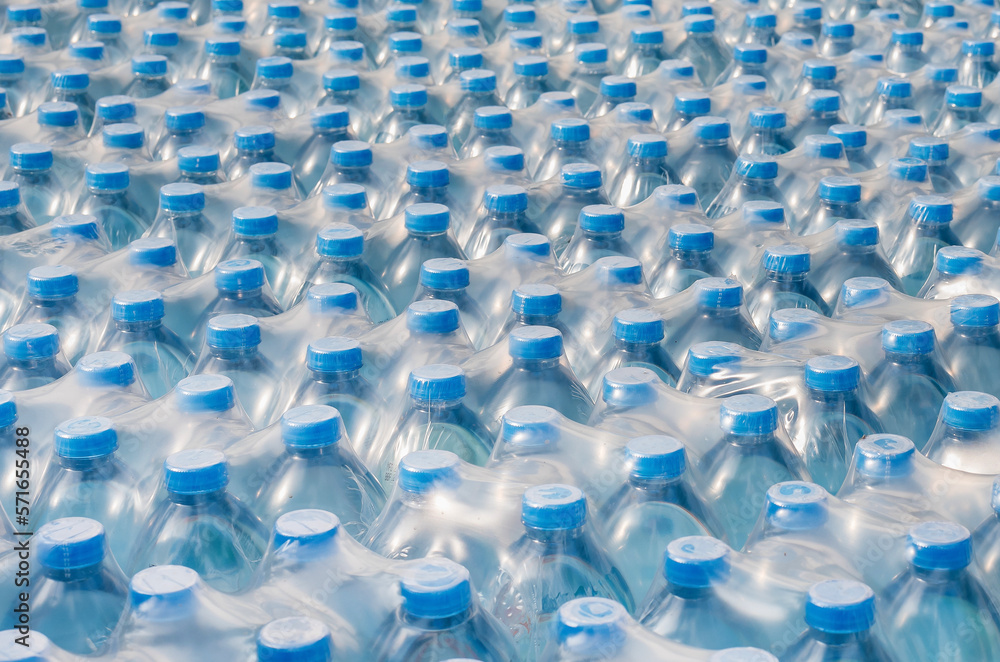 Rows of stacked plastic water bottles, Packaging of products piled in the factory area to prepare for sale Rows of stacked plastic water bottles, Packaging of products piled in the factory area to prepare for sale