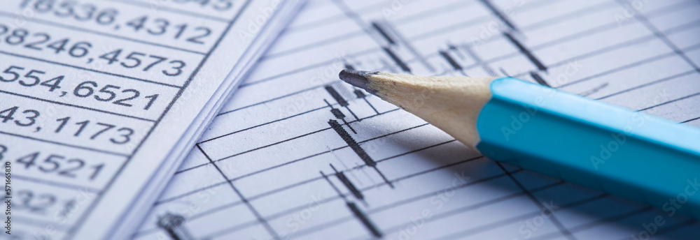 Checking the value of securities. Pencil, share listing and checking financial chart. Concept of banking, financial report and financial audit. Checking the value of securities. Pencil, share listing and checking financial chart. Concept of banking, financial report and financial audit.