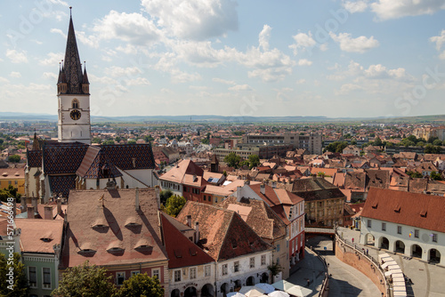 Aerial drone view of the Historic Center of Sibiu, Romania. Lutheran Cathedral, old buildings, narrow streets and the main big city Square