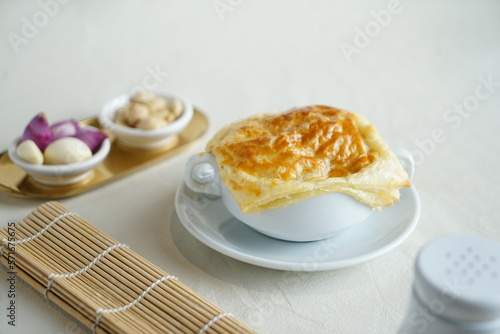 Grainy homemade creamy soup dish with corn potage and crisp puff pastry. Known as Zuppa Soup in Indonesia