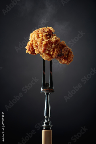Fried chicken on a fork.