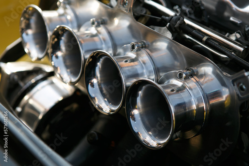 Classic car caburetor in close up. Tuner vehicle engine photo