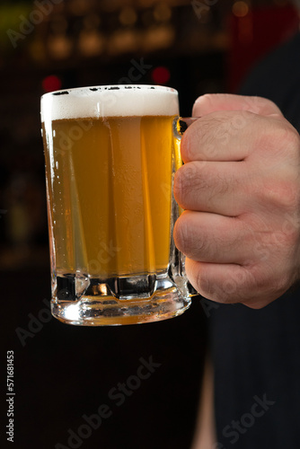 big hand with beer mug