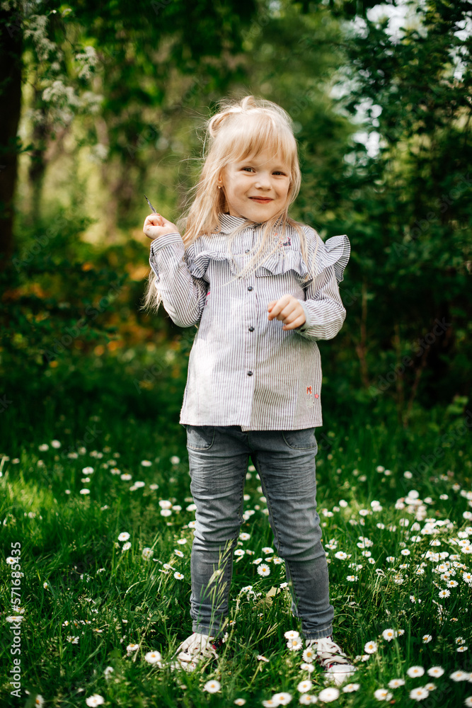 Sunny portrait of an adorable smiling little girl with long hair Sunny portrait of an adorable smiling little girl with long hair