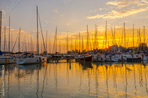 Sailing ships in the harbour of Balatonkenese at sunset © belizar