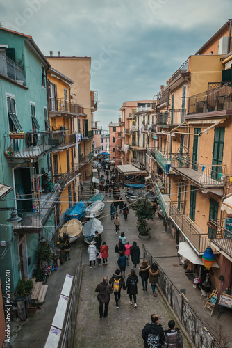 Street in touristic town, Manarola, Italy. Cinque Terre National Park. Sunny Sunset