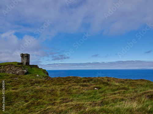Old castle tower at the cliffs of Moher in Ireland