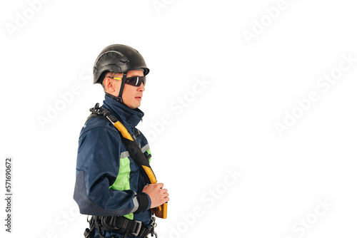 Industrial mountaineering worker in uniform and sunglasses on white empty isolated background, looking away. Rope access laborer posing. Concept of industry urban works. Copy text space advertising