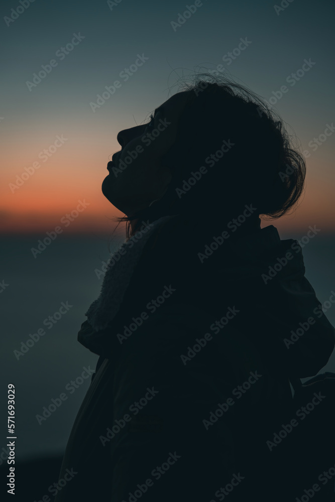 silhouette of a girl at sunset silhouette of a girl at sunset