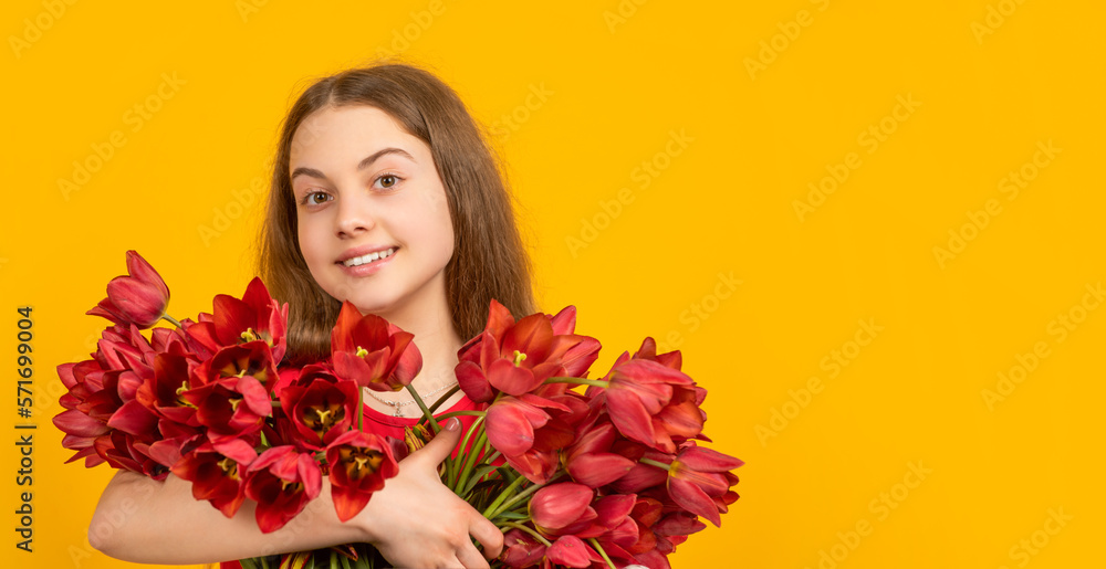 happy child hold spring tulip flowers on yellow background with copy space happy child hold spring tulip flowers on yellow background with copy space