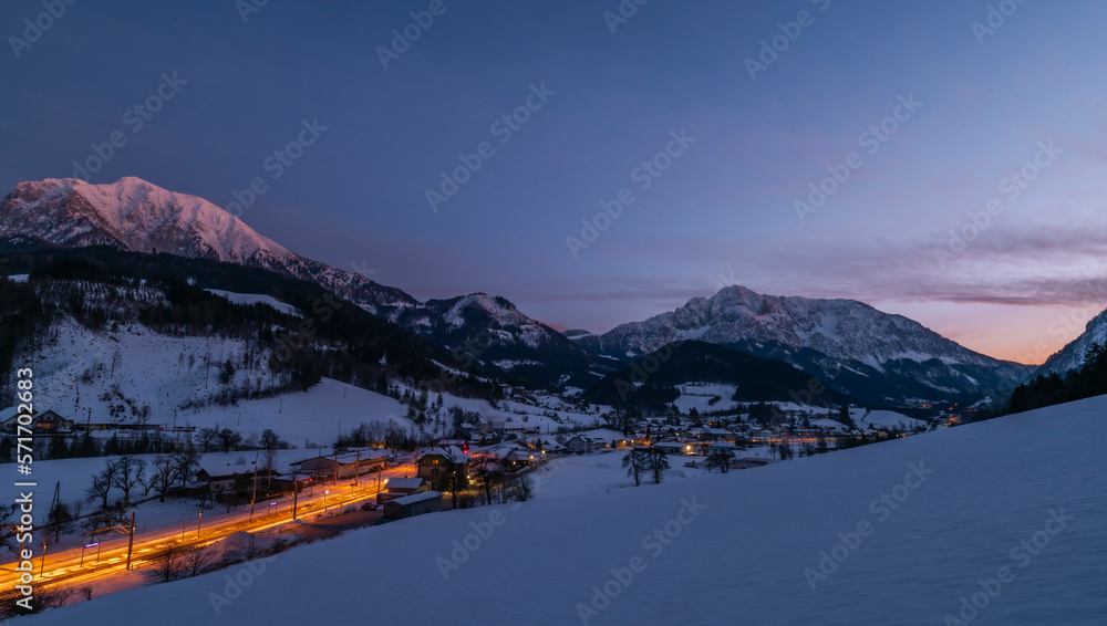 Winter evening over Spital am Pyhrn in Austria with railway station