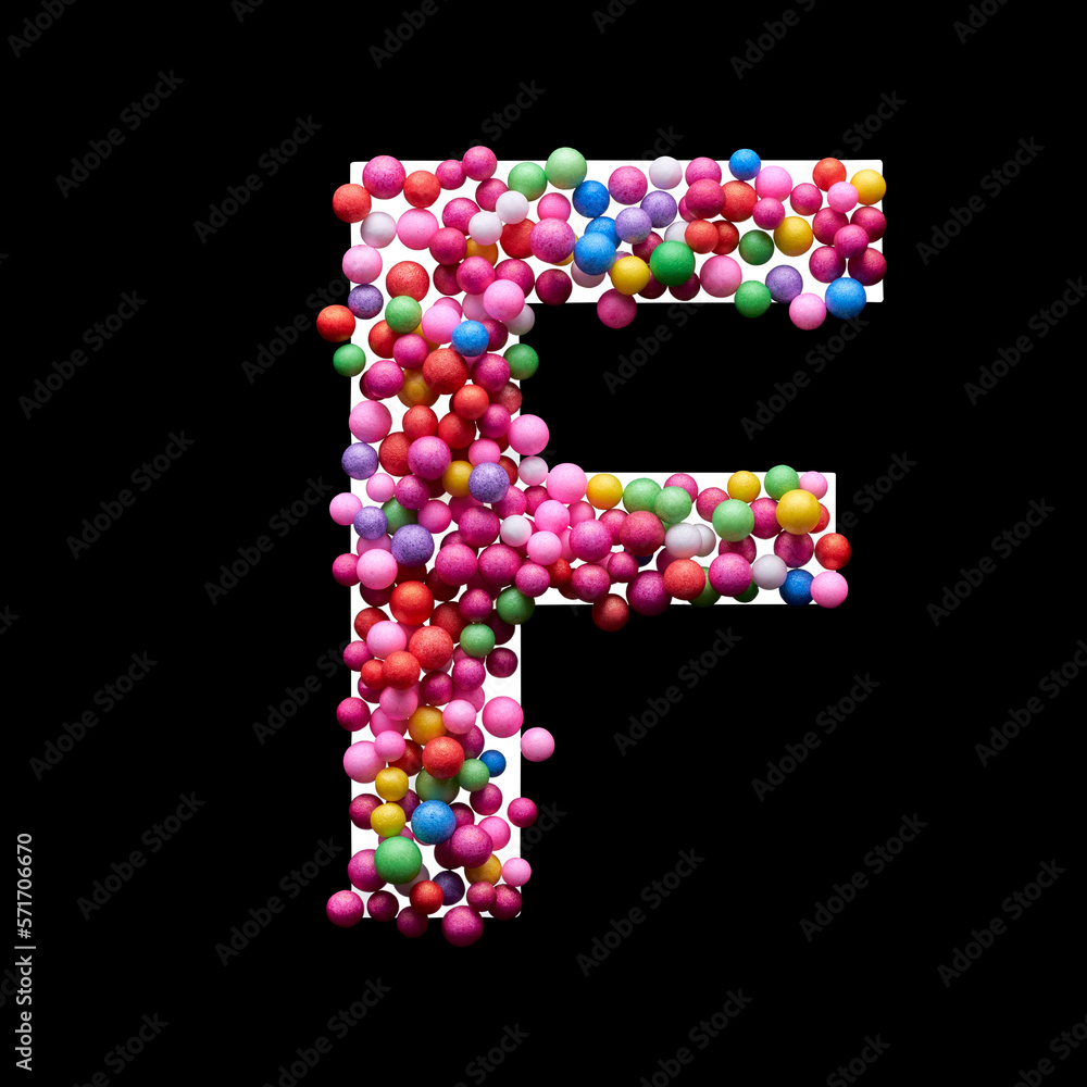 Capital letter F made of multi-colored balls, isolated on a black background.