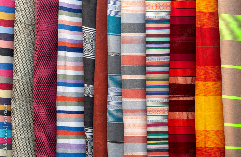 stacked colorful fabrics in the Grand Bazaar in marrakesc, Marocco