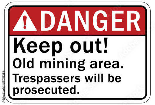 Active mine site warning sign and labels keep out  old mining area. Trespasser will be prosecuted