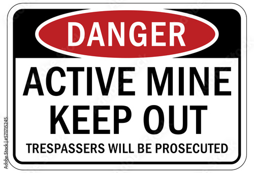 Active mine site warning sign and labels keep out. trespasser will be prosecuted