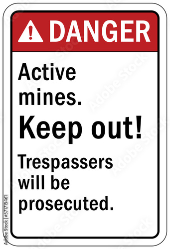 Active mine site warning sign and labels active mines, keep out. Trespasser will be prosecuted