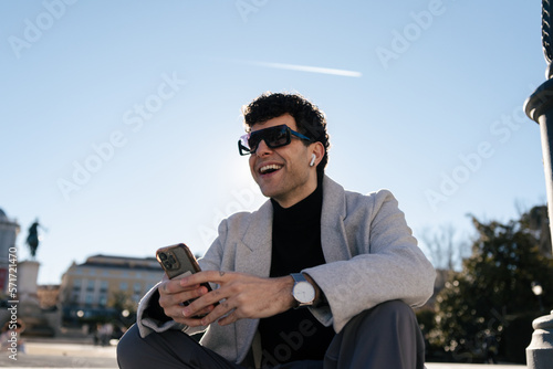 Young man using phone in the city