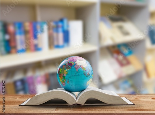 Classic school geographical globe with book, education concept