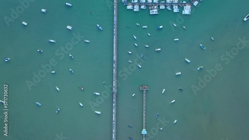 .aerial top view above the two briges at Chalong pier..Chalong bay very important for travel business it is a center for all boat and yacht marina. there have two piers for transport service tourists. photo
