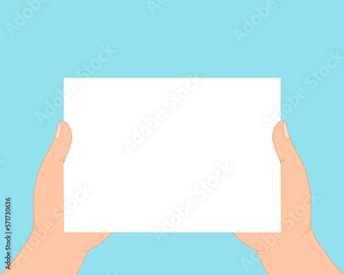 hand holding blank paper isolated on blue background 