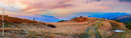 Sunrise Carpathian Mountains (Ukraine) landscape with country dirty road.
