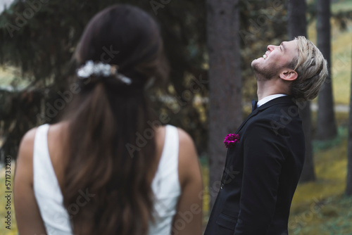 Scandinavian Bride and Groom Laughing in a Park. High quality photo