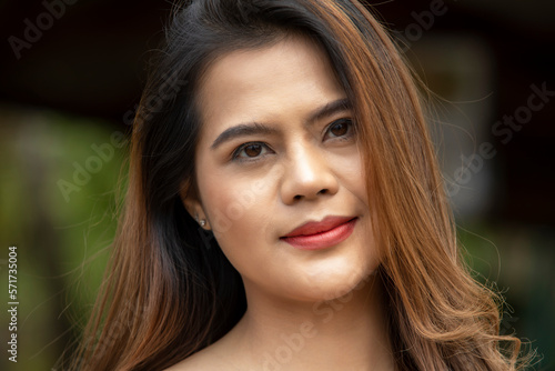 Beautiful Asian woman face portrait feeling happy smiling and looking to camera