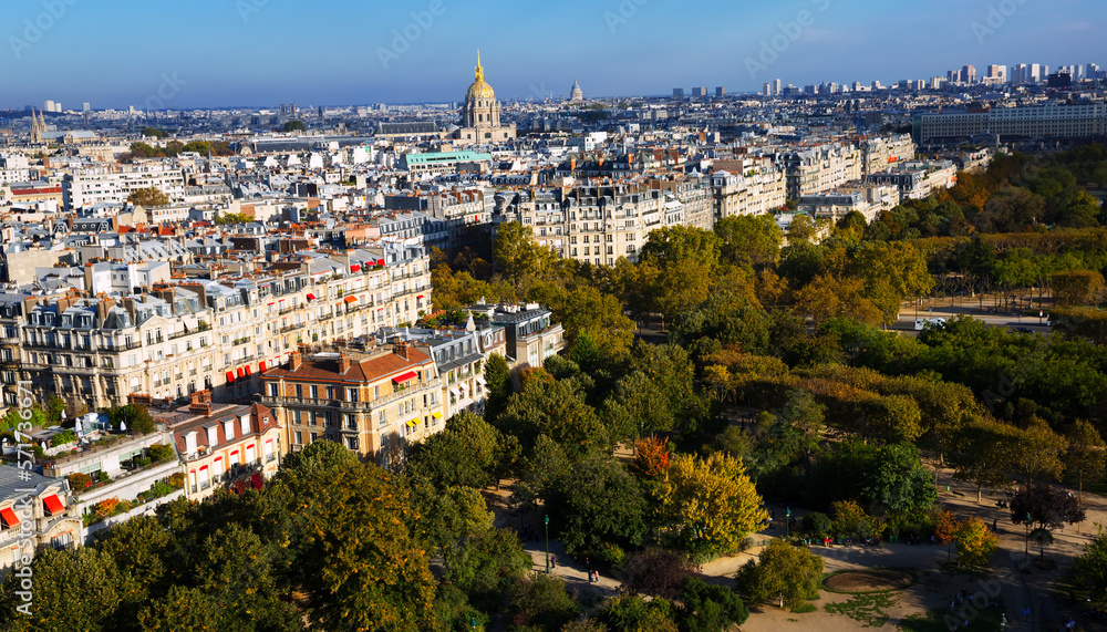 Panorama of Paris autumn cityscape with gilded dome of Hotel des Invalides in sunny day, France