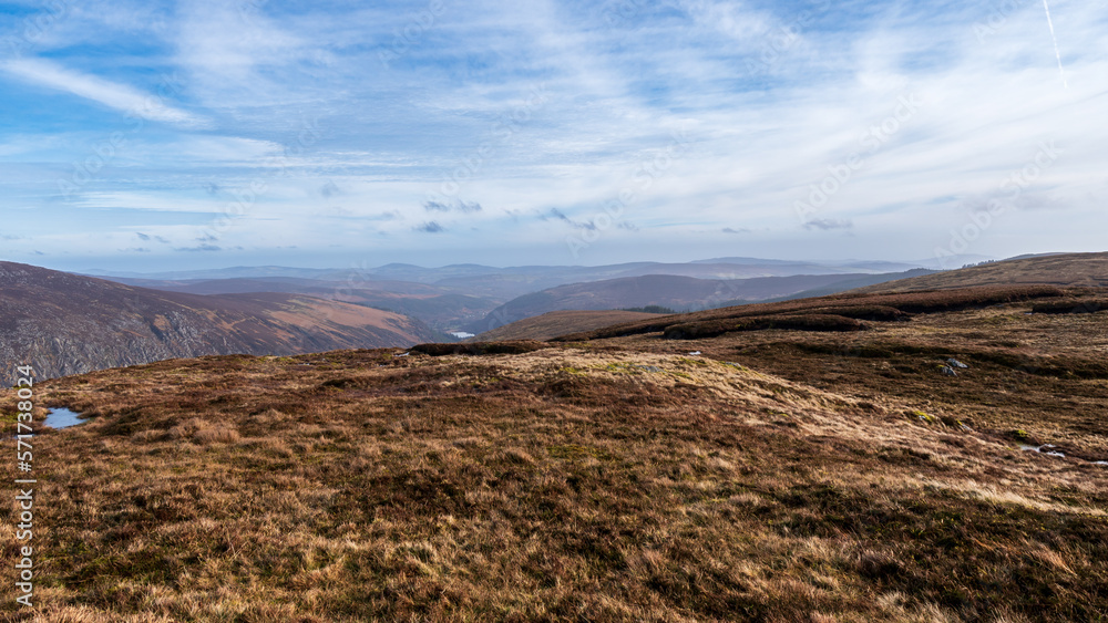 Panoramic view of Glendalough valley from Lugduff mountain during sunny summer in Ireland