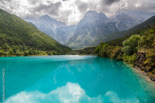 Beautiful view of Blue Moon Valley in Jade Dragon Snow Mountain reflected in clear water. It's in Lijiang, Yunnan, China