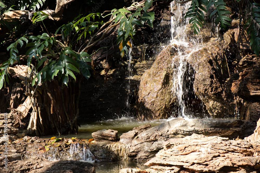 Fototapeta premium Waterfall in the garden on nature background.