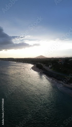 Imagem aérea do por do sol e início da noite na Enseada de Meaípe, no litoral sul de Guarapari no Espírito santo, próximo a hotéis, pousadas e restaurantes. photo
