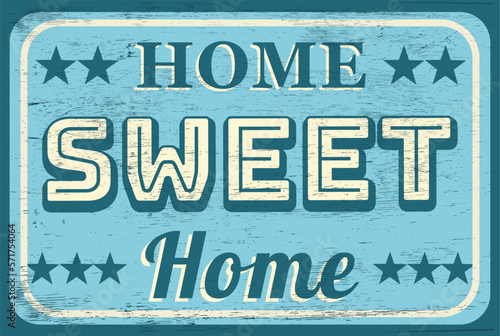 Vintage home sweet home sign on wood grain texture
