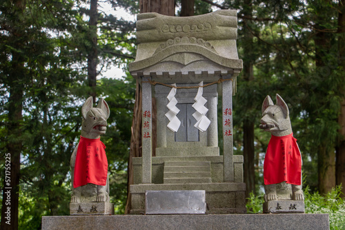 A traditional Japanese shrine - altar in a forest around Satomiya Sanctuary, Fuji omuro sengen-jinja shrine (Fujiomurosengen Shrine). Shintoism temple, Japan. photo
