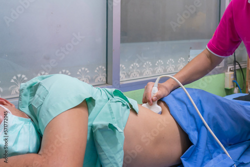 Closeup of man getting an ultrasound scan on abdominal by doctor