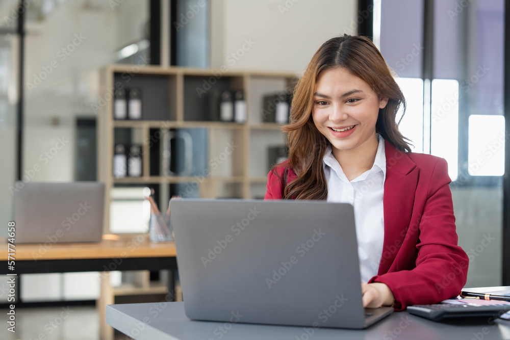 Business woman using calculator for do math finance on wooden desk in office and business working background, tax, accounting, statistics and analytic research concept. Business woman using calculator for do math finance on wooden desk in office and business working background, tax, accounting, statistics and analytic research concept.