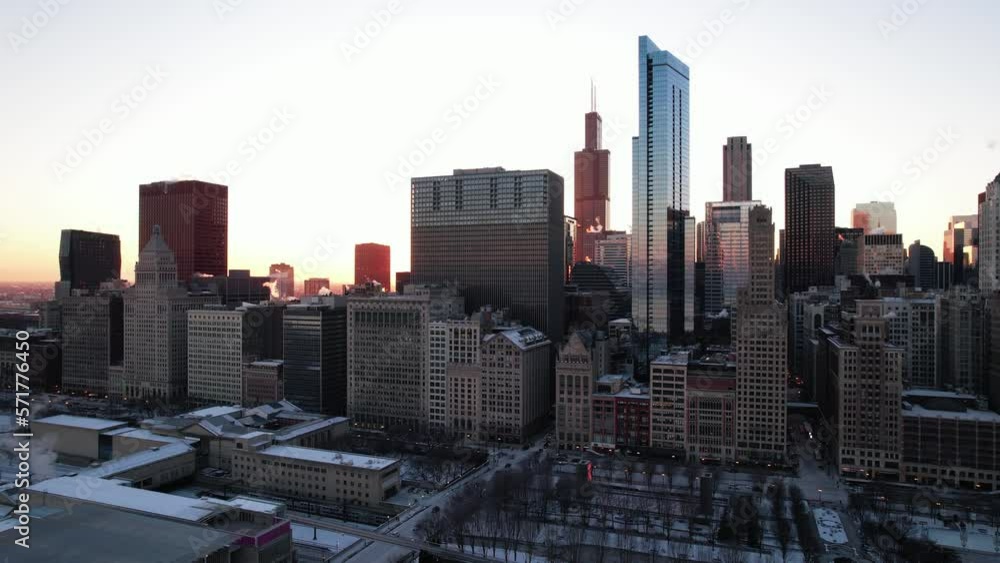 rising aerial of smoking buidings, chicago arhitecture in winter time at the sunset. Majestic golden hour. rising aerial of smoking buidings, chicago arhitecture in winter time at the sunset. Majestic golden hour.