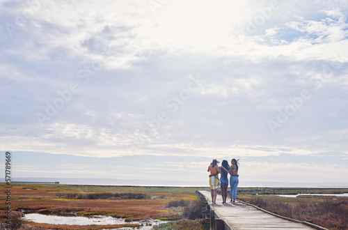 Travel, friends and women walking while on a vacation, adventure or outdoor journey in nature. Freedom, bonding and female best friends on a walk while on a holiday or weekend trip in the countryside