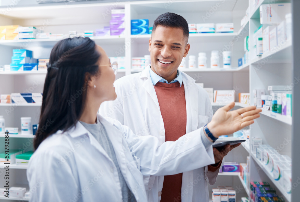 Pharmacy, employees and discussion with healthcare, inventory for stock and teamwork. Pharmacist, man and woman talking, planning and prescriptions with happiness, staff and medical professionals