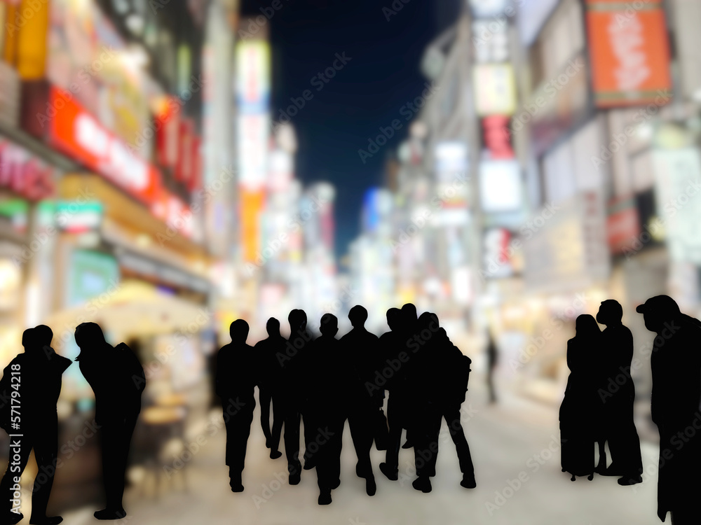 夜の繁華街を歩く人々のシルエットボカシイメージ