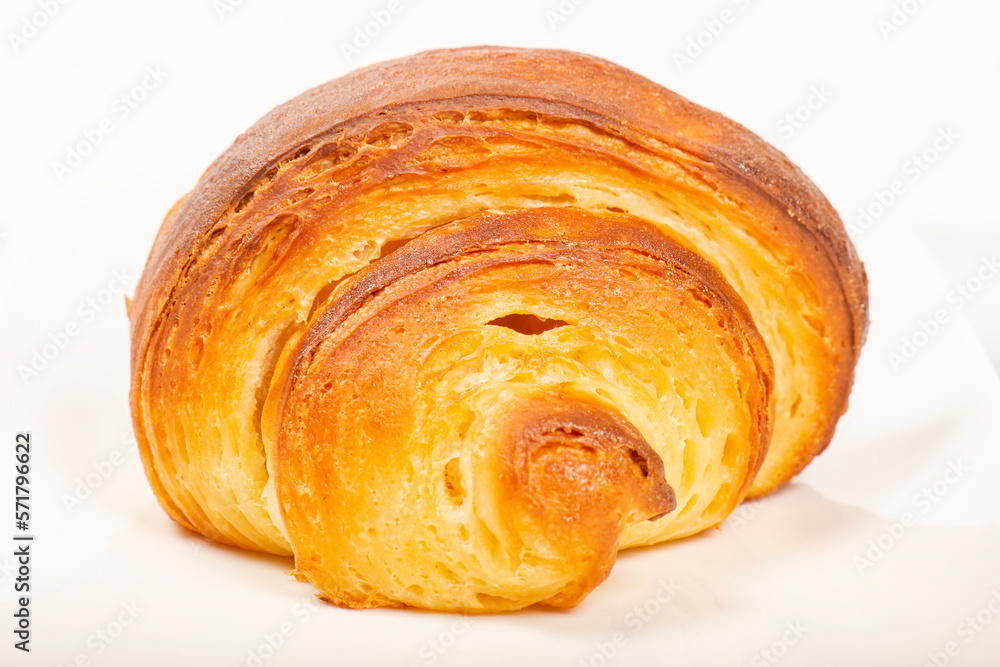 Fresh baked homemade plain butter croissant with a beautiful open honeycomb. Fresh baked homemade plain butter croissant with a beautiful open honeycomb.