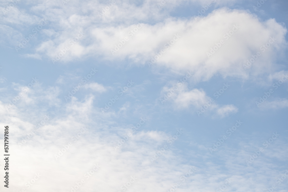 White clouds against the blue sky. Cloudy sky background. White clouds against the blue sky. Cloudy sky background.