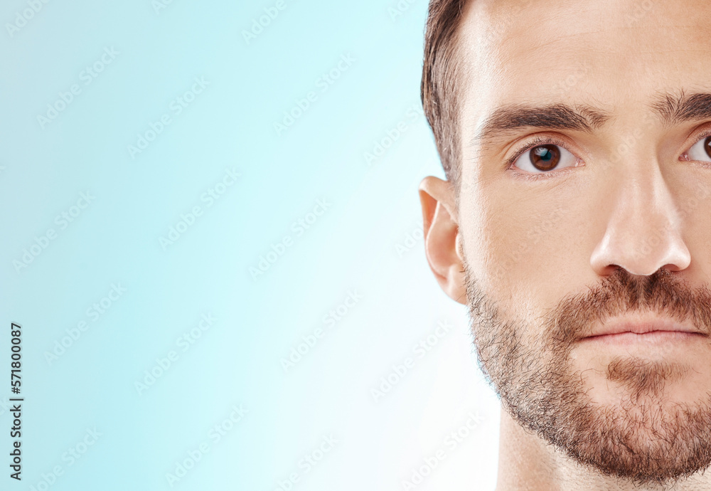 Fototapeta premium Man, face and skincare for clean hygiene or grooming isolated against blue studio background. Portrait of male model head in facial cosmetics, beauty or spa treatment for self love or care on mockup